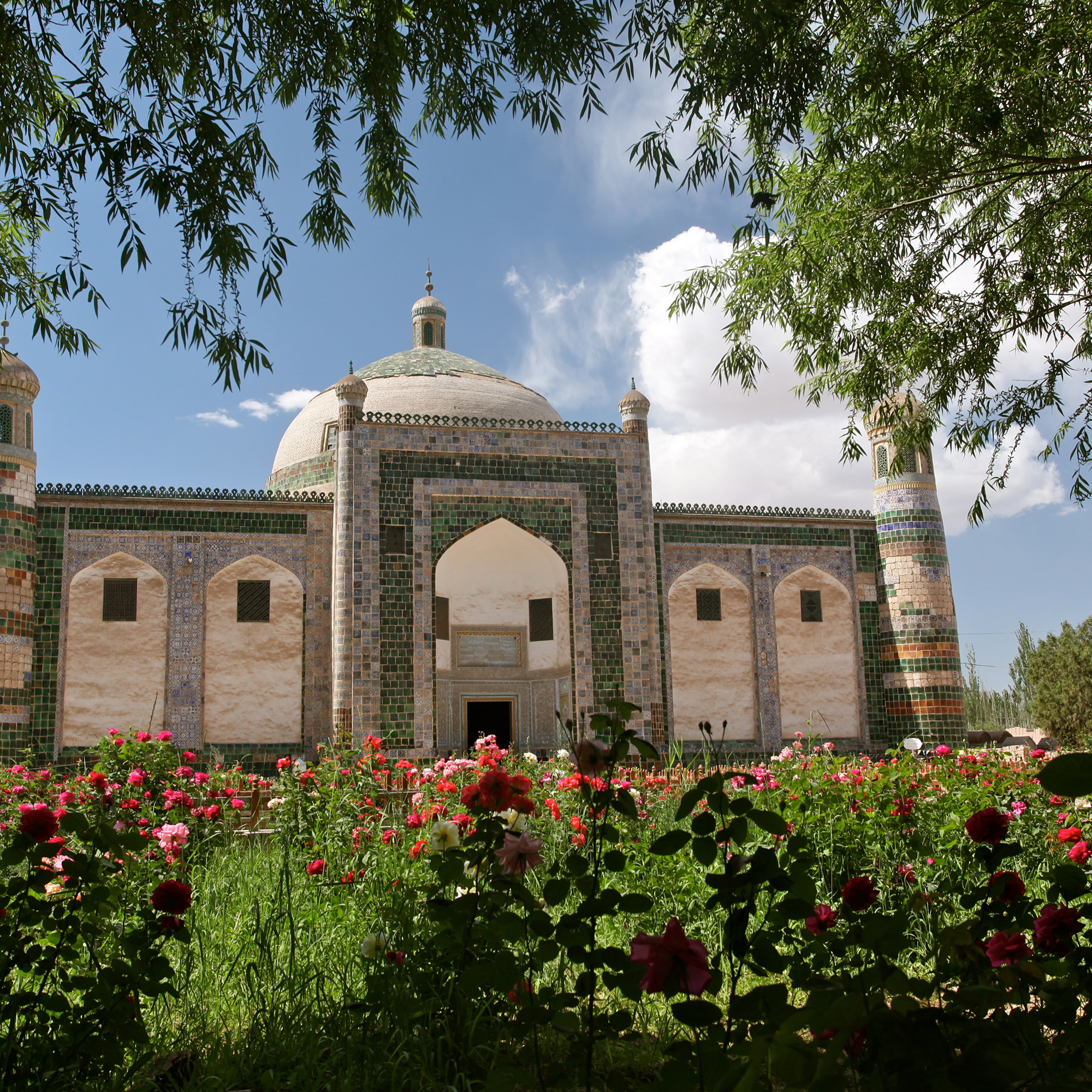 Tiled mausoleum with a rose garden in front